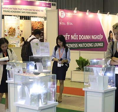 visitors inspecting products