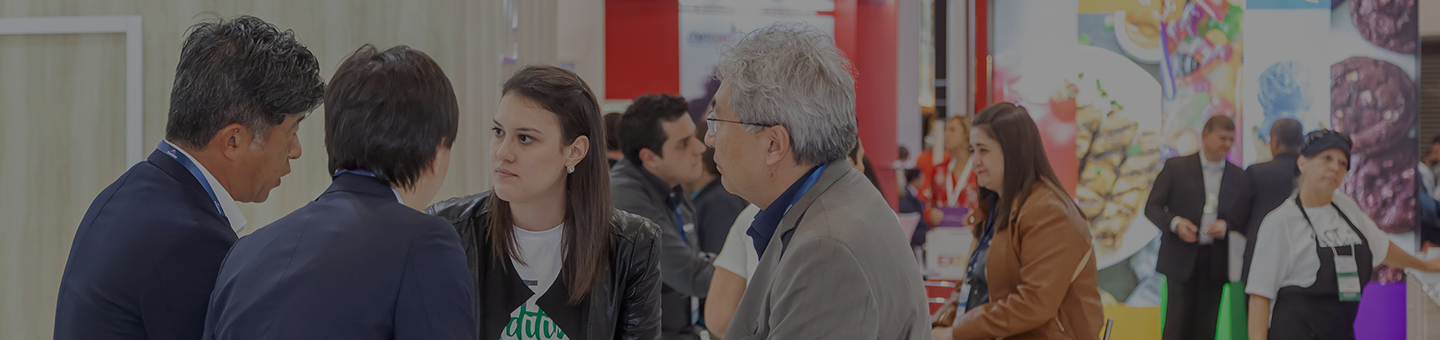 Exhibitors talking with visitors at Fi South America