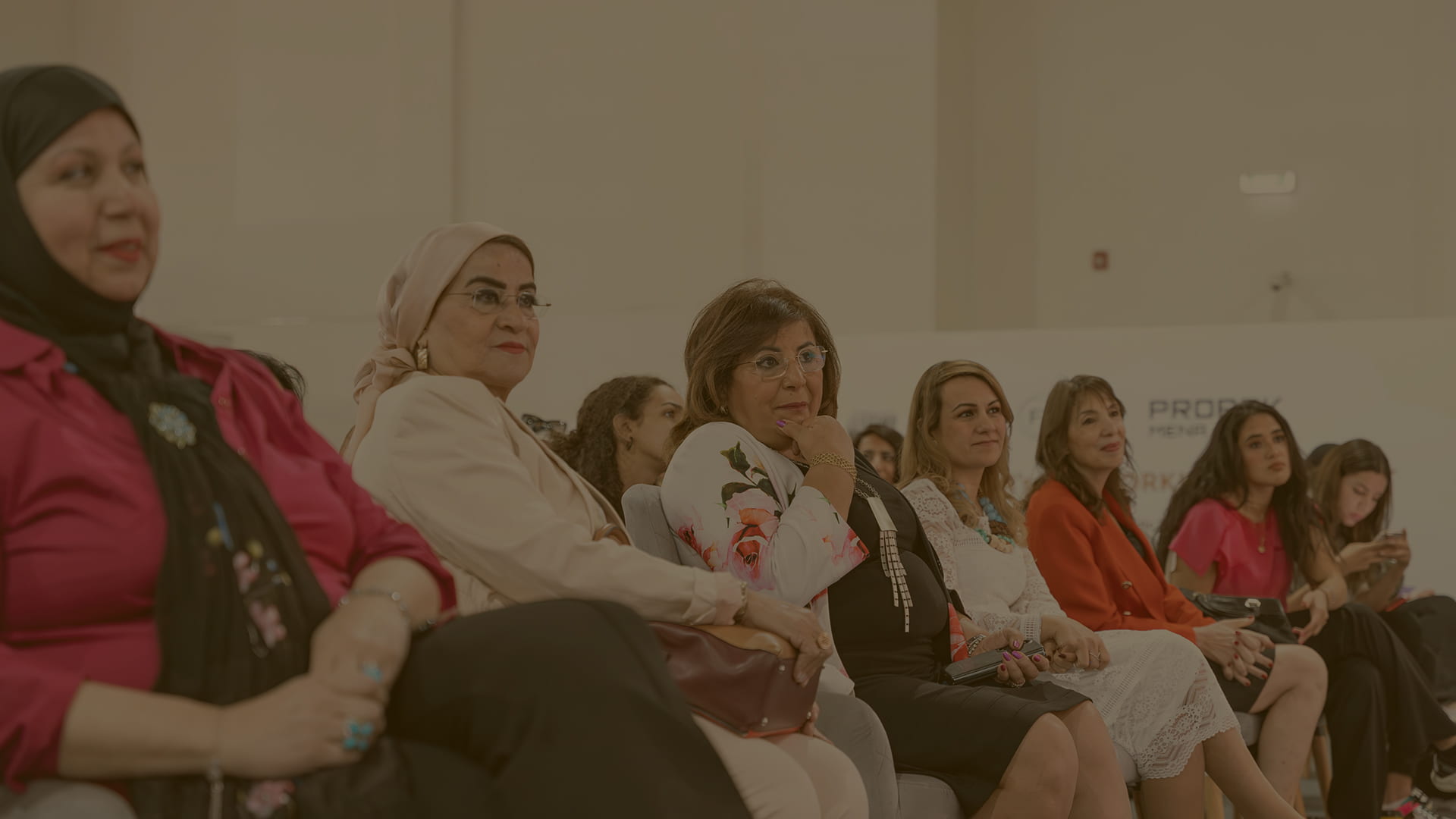 Attentive female audience engaged in a conference discussion at Fi Africa.