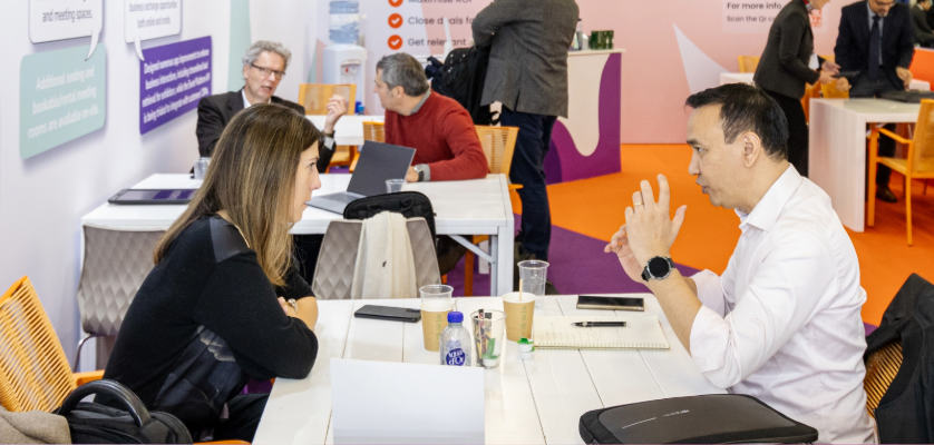Two people networking at Fi Europe