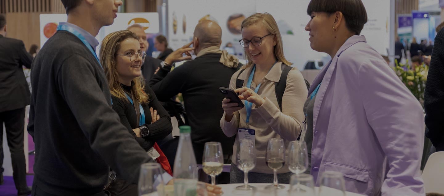 Fi Europe exhibitors having a business meeting