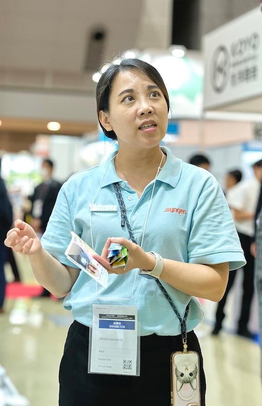 exhibitor answering a question at Hi Japan