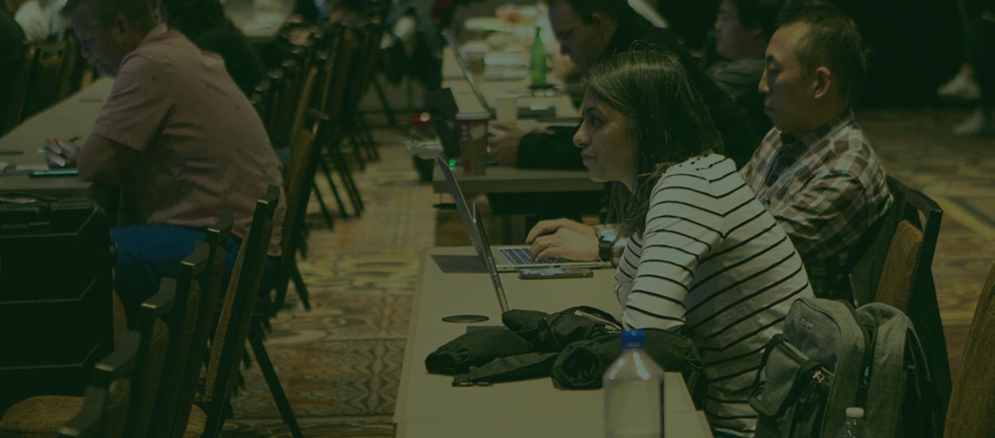 Visitors at table during a speaking session