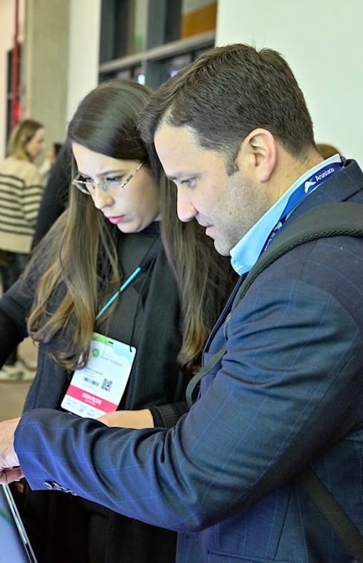 Exhibitor talking with an attendee 