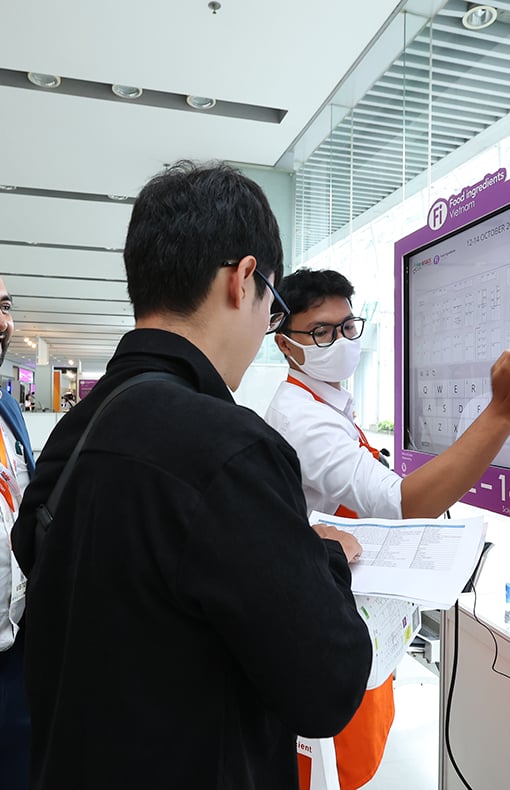 Exhibitor presentation to a visitor at Fi Vietnam