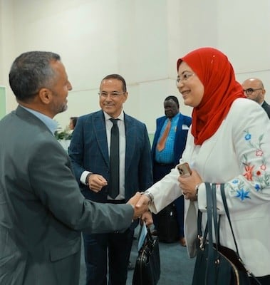 Attendees shaking hands at Fi Africa.