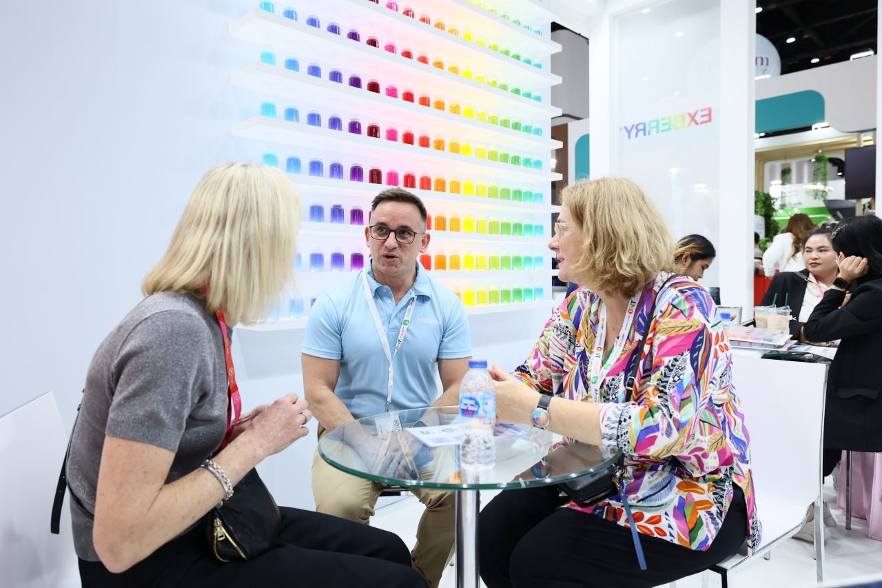 Visitors listening to exhibitor
