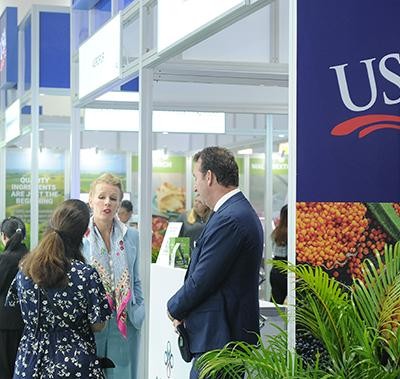 Visitors talking at a stand