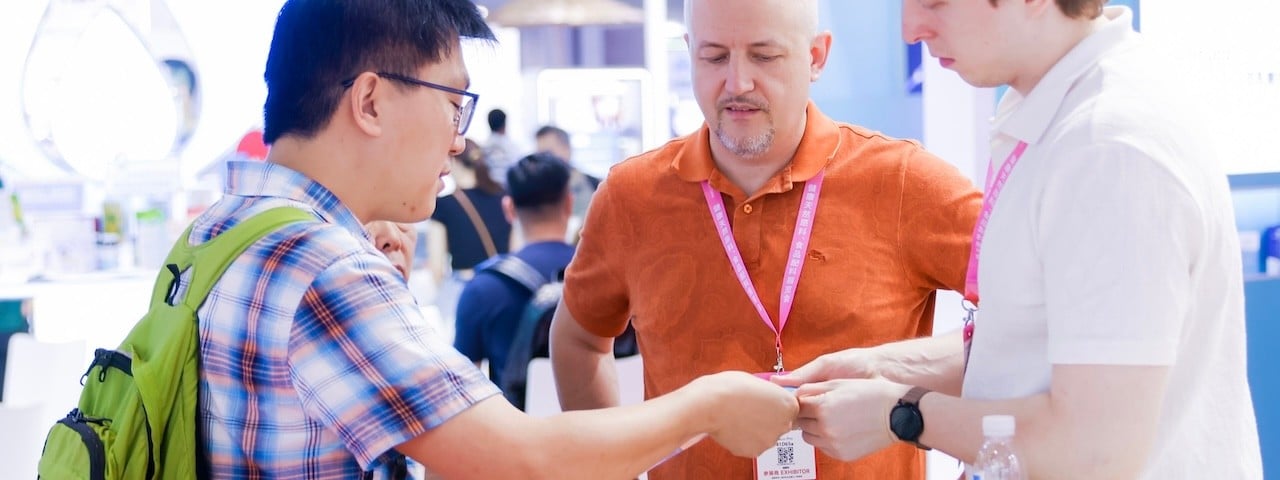 visitors at an exhibitor stand