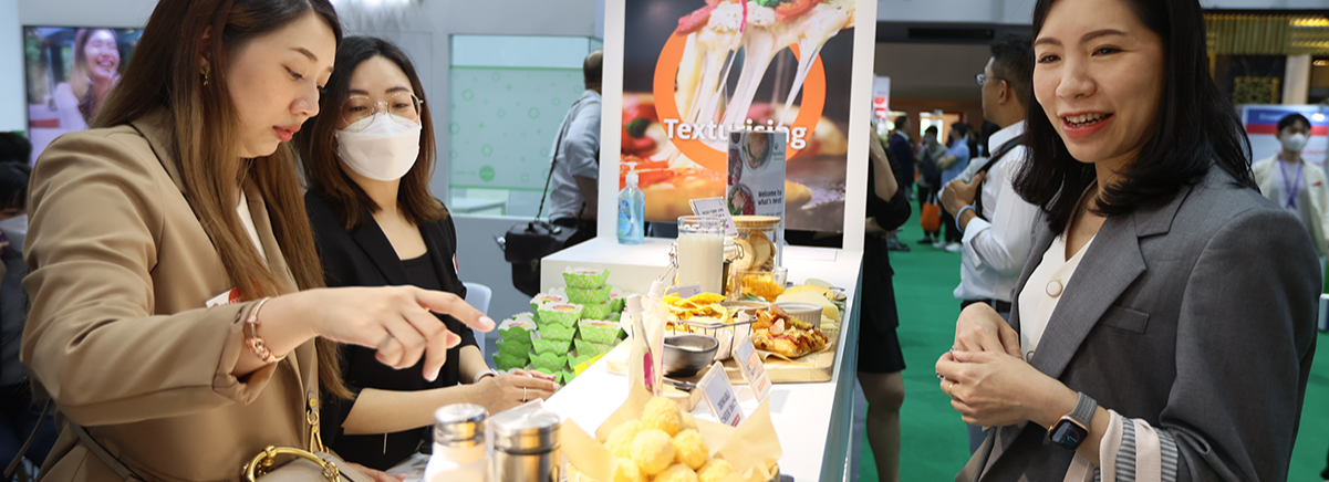 visitors at an exhibitor stand