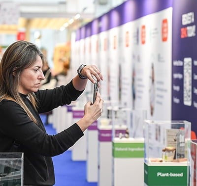 Visitor taking picture of product in New Product Zone at Fi Europe