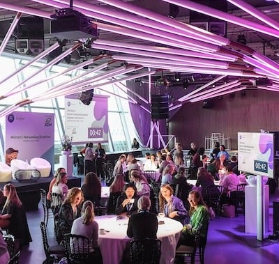 Visitors networking at exhibitor stand Fi Europe