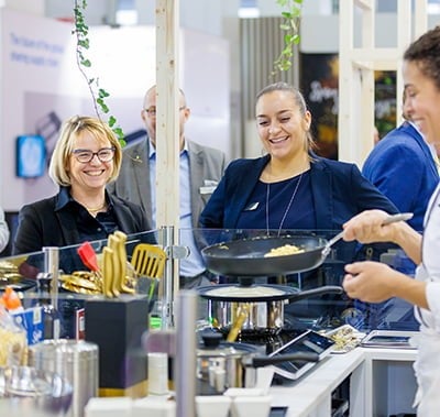 Exhibitor cooking in front of visitors at Fi Europe