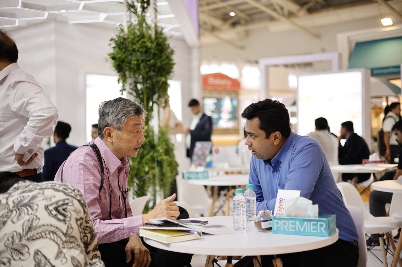 Visitors listening to exhibitor