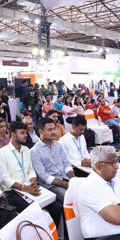 Visitors listening to exhibitor