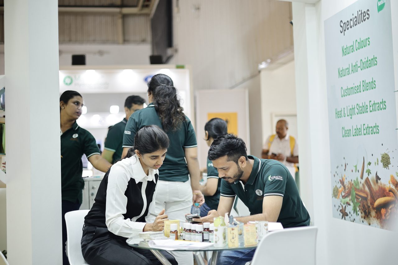 Exhibitor and attendees speaking