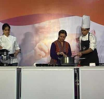 Chef on stage at Fi India