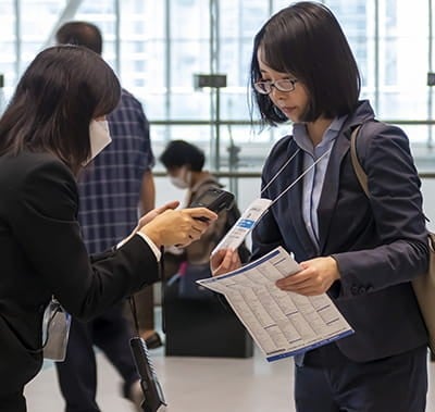 visitor having badge scanned at Hi Japan