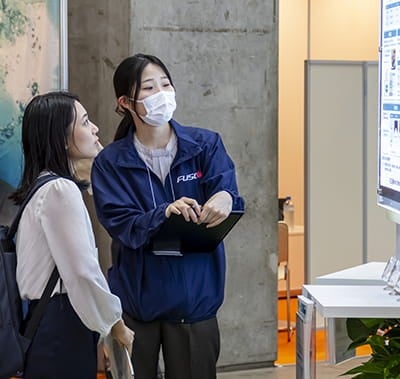 Visitors looking at exhibitor stand at Hi Japan