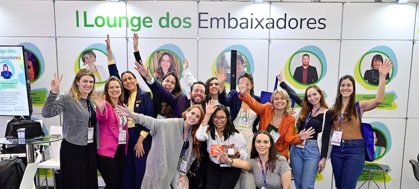 Event attendees smiling at Fi South America