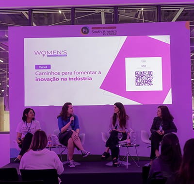 Speakers on stage during the women's networking breakfast at Fi South America