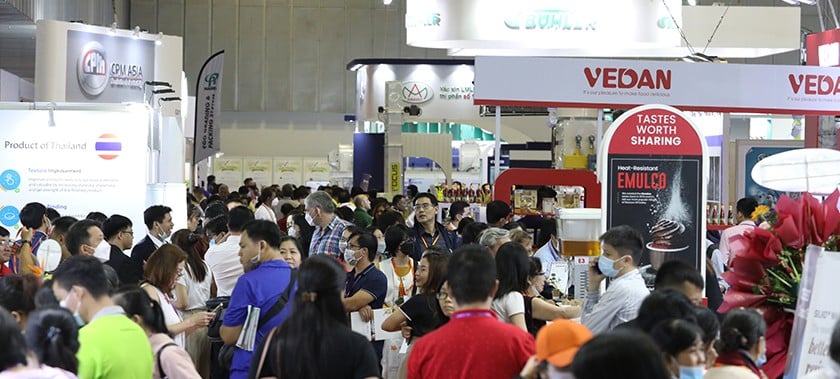 Busy show floor with people at Fi Vietnam