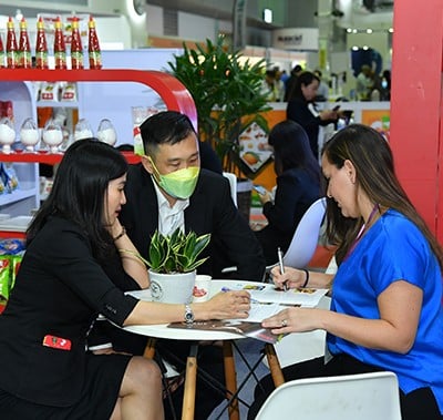 Visitors meeting at table at Fi Vietnam