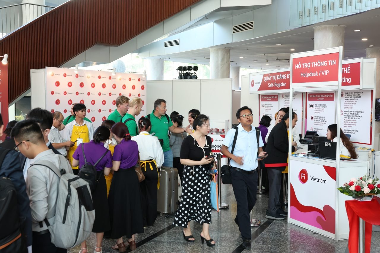 Exhibitor handing out tasters at Fi Vietnam