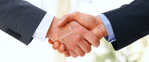 two people shaking hands with each other