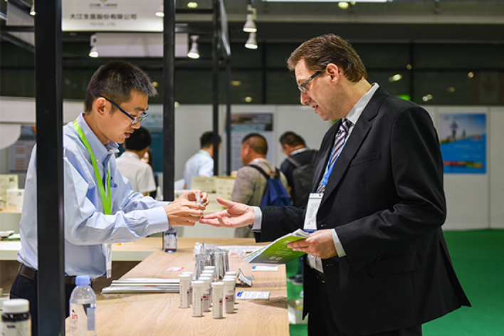 Attendees at Hi & Fi Asia-China exchanging business cards