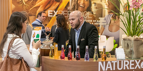 Exhibitors networking with attendees at Fi South America